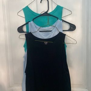 set of three teal, light blue, and black tank tops